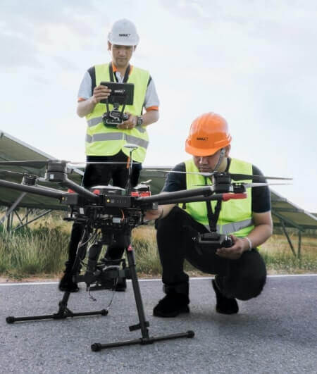 SRM technicians preparing drone.