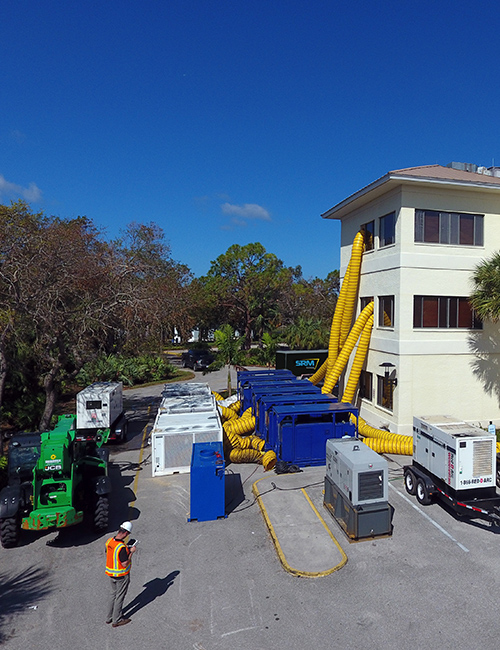 SRM technicians working on a commercial building. 